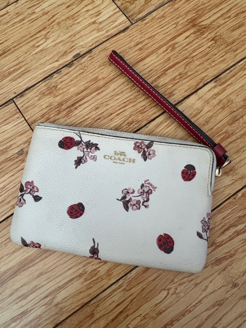 Coach Cream Floral & Red Ladybug Wristlet with Red Strap